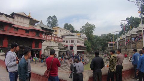 Pashupatinath Temple in Kathmandu, Nepal - Oct 24th, 2019. Famous and sacred Hindu Pashupatinath temple complex located on the banks of the Bagmati River in Kathmandu Valley. The cremation ceremony