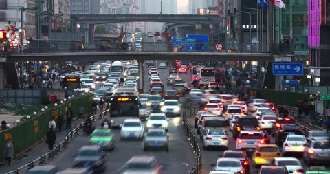 Chengdu,Sichuan/China-December 3th 2019: time lapse of traffic jam in the city at rush hour cars driving on the crowed street at evening when people get off work