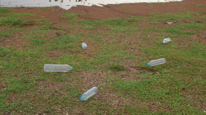 Happy young Asia activists collecting plastic waste on the beach. Korean lady volunteers help to keep nature clean up and pick up garbage. Concept about environmental conservation pollution problems.