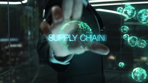 Businessman with Supply Chain hologram concept