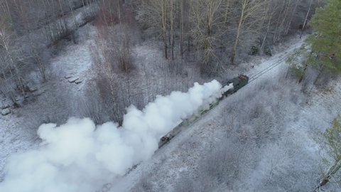 Old steam train locomotive in winter aerial view