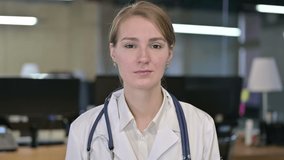 Portrait of Beautiful Young Female Doctor doing Video Chat