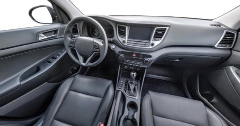 panorama in interior leather salon of prestige modern car. steering wheel, shift lever and dashboard isolated on white background