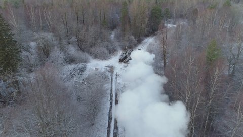 Steam train locomotive in winter aerial view