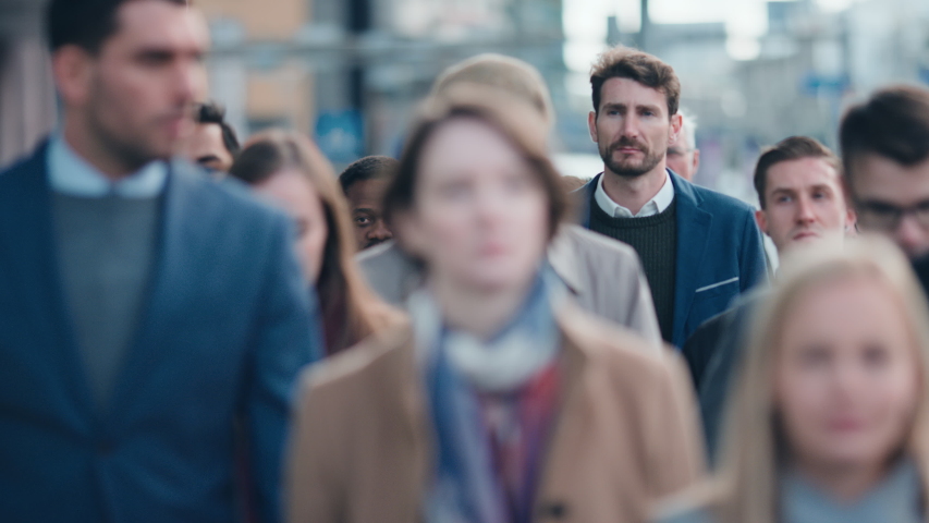Diverse and Multicultural Office Managers and Business People Commute to Work in the Morning or from Office on Foot. Pedestrians are Dressed Smartly. Successful People Walking in Downtown. | Shutterstock HD Video #1042199398