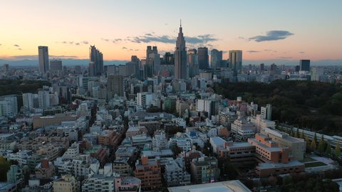 Aerial view of cityscape of Tokyo, capital city of Japan at sunset, skyscrapers skyline of modern district Shinjuku - landscape panorama of Japan from above, Asia