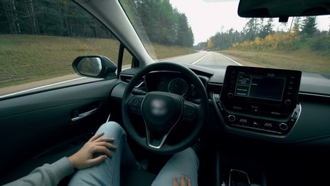 Modern car driving on autopilot. Autopilot car, intelligent vehicle, driveless automobile concept.