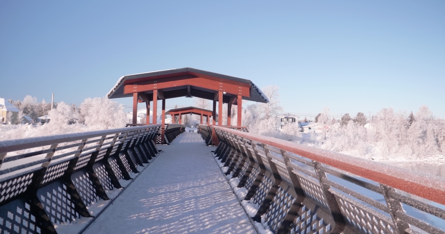 Amos, Abitibi Québec/Canada-12-01-2019: Sweet hoarfrost morning.  Haricana river Haricana River overlooked by the footbridge  Ulrick Cherubin.