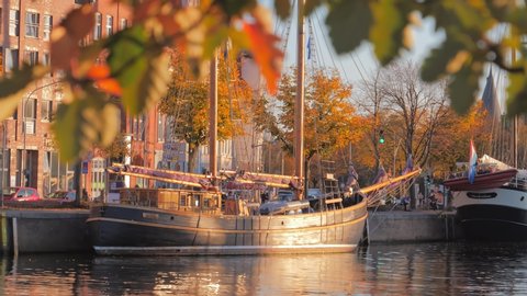 LUBECK, GERMANY- OCTOBER 13, 2018: Old ships on the River Trave, autumn time, Lubeck, Germany