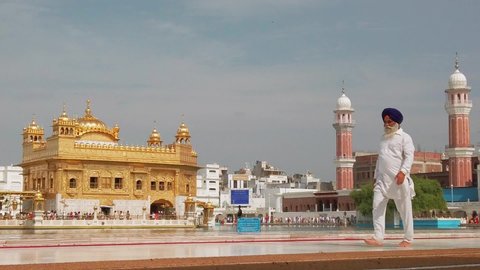Amritsar, India - Circa October 2019. Beautiful view of Golden temple in Amritsar. Slow motion video.