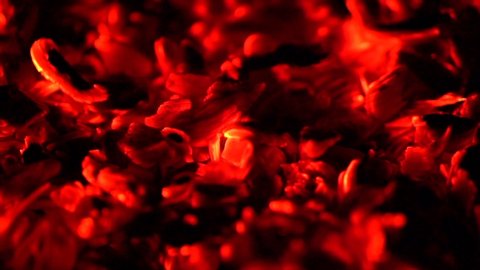 Burning charcoal background. Burn coals at night closeup, Fire, fireplace. Decaying charcoals, barbeque. Texture of red hot coal backdrop. Grill, Barbecue, BBQ, Slow motion 4K UHD video