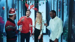 Happy carefree multi-ethnic coworkers of data center having exciting corporate party, celebrating Christmas and New Year winter holidays in database server. Excitement concept. - Powered by Shutterstock - Get 15% off with code: PIKWIZARD15