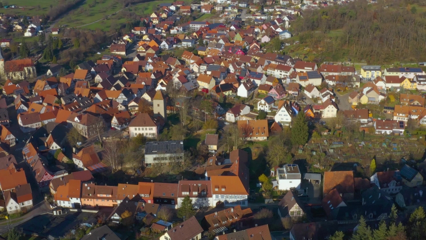 Aerial view of the village Stein in Germany on a sunny day in autumn. Pan to the left around the old town.