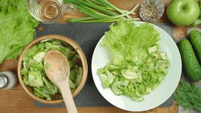 Video of cooking salad on board with vegetables