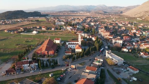 Tuzi, the youngest municipality in Montenegro, in the afternoon, close to sunset. Center of Malesi e Madhe District, populated mainly by Malisors. Drone fly over shot.