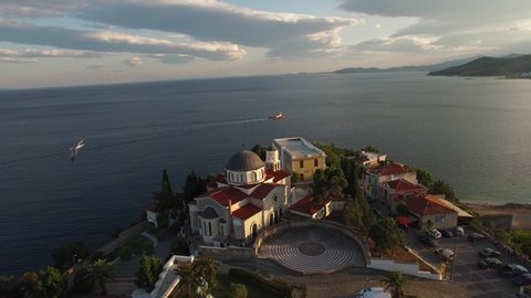 Aerial of the church by the cliff of Kavala Bay. Greece. 