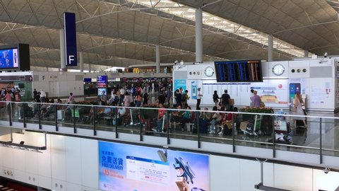 HONG KONG - SEPTEMBER 2019: People at the departure area of the Hong Kong International airport. It is the main airport in Hong Kong located on the island of Chek Lap Kok