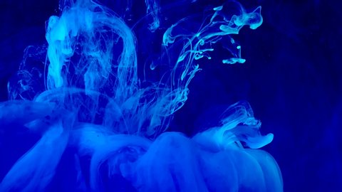 Amazing blue abstract background. Stylish modern background. Cool trending screensaver. Watercolor ink in water on a black background.