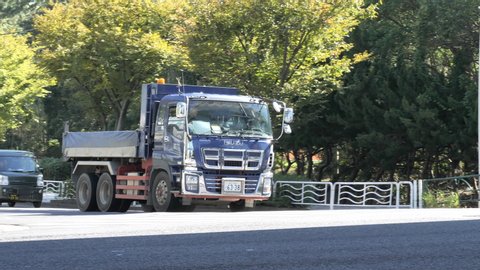 Tokyo Japan 2019 November 03: Tokyo Japan 2019 November 03:One of the many trucks passing in the road in Tokyo Japan going under the skyway road in the city