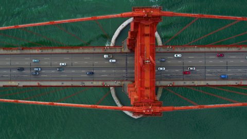 
Aerial overhead view of the Golden Gate Bridge full of traffic. San Francisco, California. USA. High view of freeway during rush hour. US route 101  and SR 1 full of cars. Shot on Red weapon 8K.