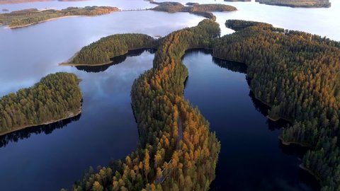 Finland. Flying over lakeland and forest after sunset. Aerial shot, UHD