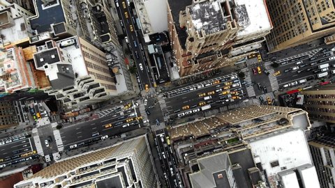 New York, United States. October 28, 2018. Aerial top view of downtown building roofs. Bird's eye view from helicopter of cityscape metropolis infrastructure, traffic cars,yellow cabs,crossing streets