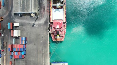 Aerial view of container ship in the port Fortaleza. Container vessel complete cargo operations and ready to sail operations. Ship cranes secured.
