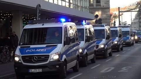 Braunschweig, Germany, November 30., 2019: A group of police transporters are driving through downtown at walking speed.