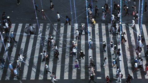 High Angle Shot of a Crowded Pedestrian Crossing in Big City. Augmented Reality Shows Visual Representation of Connected People with the Internet World, Technology Around Us and Wi-Fi  Wave Network.