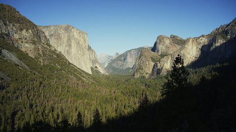 Panning shot of scenic view of trees and El Capitan / Yosemite Valley, California, United States