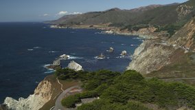Aerial view of ocean waves on rocky coast / Big Sur, California, United States
