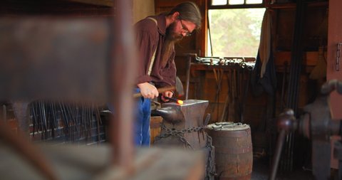Mount Vernon, Virginia / USA - November 13, 2019: Historical Reenactment of Old Fashioned Blacksmith Shop, Slow Motion