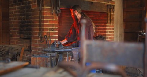 Mount Vernon, Virginia / USA - November 13, 2019: Old Fashioned Blacksmith With Forge, Slow Motion