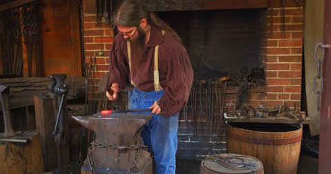 Mount Vernon, Virginia / USA - November 13, 2019: Old Fashioned Blacksmith With Hammer, Slow Motion