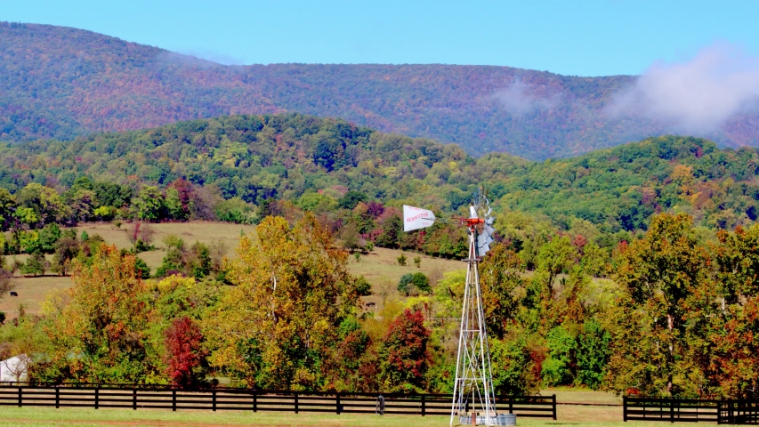 Beautiful Rolling Hills with Fog & Windmill, Farm Landscape, Aerial Drone