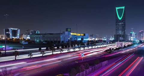 Riyadh saudi arabia 21-04-2019 : timelapse for king fahd street night with kingdom tower and street lines for the traffic