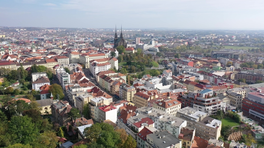 Panoramic view from drone of historical center of Czech city of Brno overlooking medieval Cathedral of Saints Peter and Paul on sunny autumn day, South Moravian Region 
