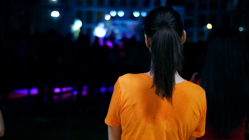 Woman applause at a concert