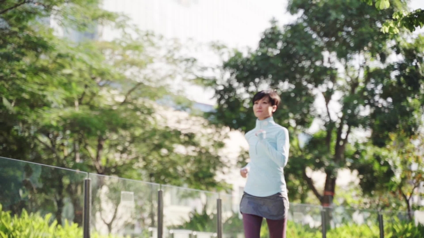 Asian beauty jogging in city park in morning slow motion | Shutterstock HD Video #1042382866