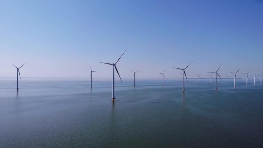 Wind turbine from aerial view, Drone view at windpark westermeerdijk a windmill farm in the lake IJsselmeer the biggest in the Netherlands, | Shutterstock HD Video #1042385542