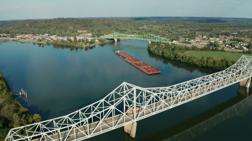 River Barge Slowly Moves Thru the Ohio River Between Henderson and Point Pleasant WV