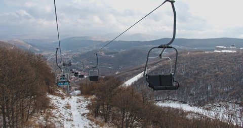 cable car with mountain and city views in winter