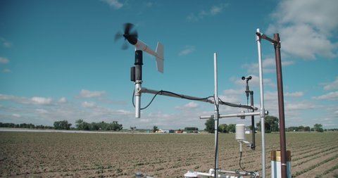 Weather station on research farm measuring moisture and wind