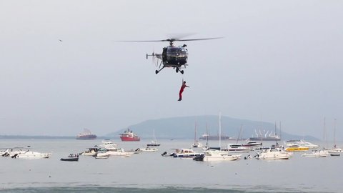 Indian Navy Chetak Helicopter demonstrating rescue operation during Indian Navy Day 2019 aerial display event at Gateway of India, Mumbai. 4832.