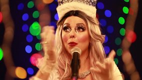 Video clip young woman singer in a New Year’s costume Snow Maiden sings a song in stage light - Powered by Shutterstock - Get 15% off with code: PIKWIZARD15