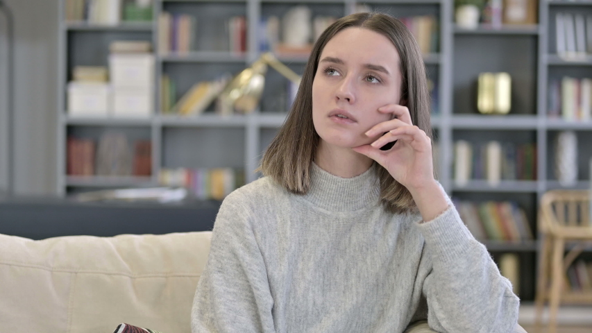 Portrait of Thoughtful Young Woman Thinking