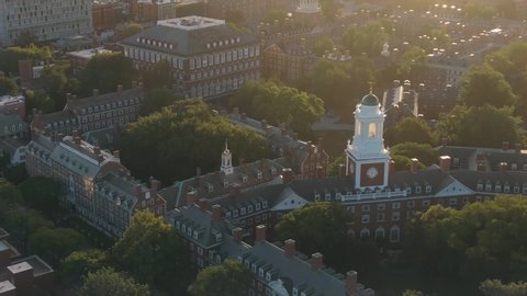 Aerial: flying over Harvard University at sunrise. Boston, Massachusetts, USA. 28 August 2019 