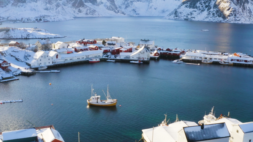 aerial dron view of famous traditional multicolored wooden fishing houses rorbu on a sea shore at Lofoten archipelago, nothern Norway
