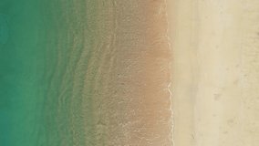 Nature footage of Beautiful sand Tropical sea with wave crashing on beach aerial view drone shot Top view