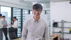 Portrait of successful handsome executive businessman smart casual wear looking at camera and smiling, happy in modern office workplace. Young Asia guy standing relax in contemporary meeting room. - Powered by Shutterstock - Get 15% off with code: PIKWIZARD15